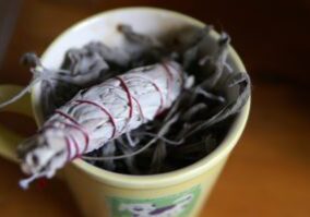 My sage smudge stick and my cup for dried sage leaves to make more sticks as needed.